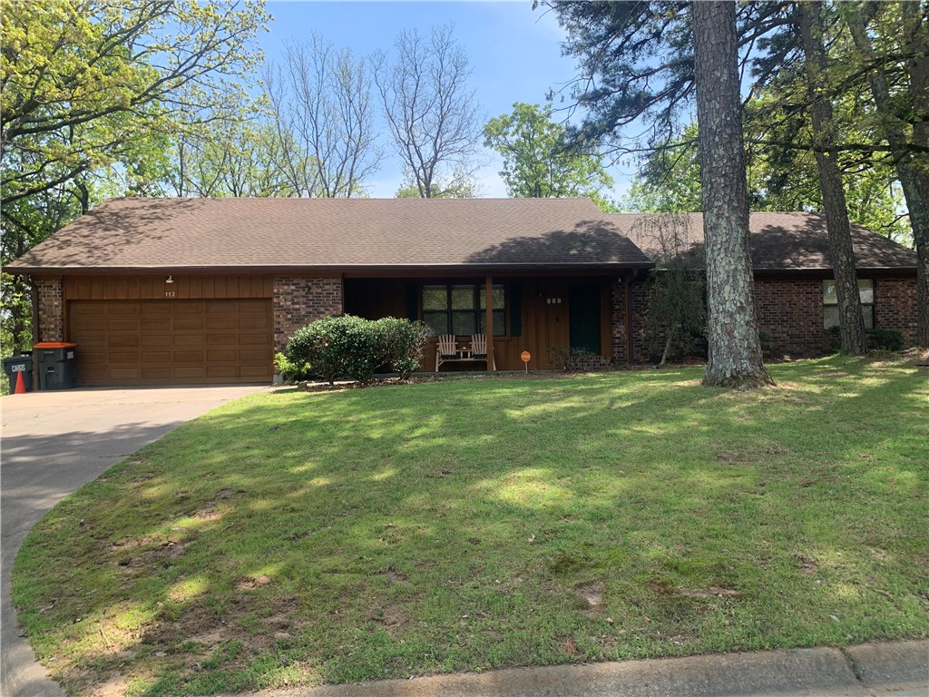 This 3 bed/2 bath home is in one of Russellville's most sought-after neighborhoods. Just minutes from Lake Dardanelle and town. It sets in a private wooded area overlooking Russellville. The large deck on the back is perfect for outdoor entertaining a big group or a private peaceful place to just relax. The inside offers an open floor plan with lots of windows for natural light. the kitchen has beautiful granite countertops and custom cabinetry. The adjoining dining and family area comes with a cozy fireplace. There is also a separate living/bonus room for added privacy. The washer/dryer room just off the kitchen has its own sink and pantry for added storage. The large 2 car garage come with a custom cabinet for storage and a work area for projects. Must see this home to appreciate all it has to offer!