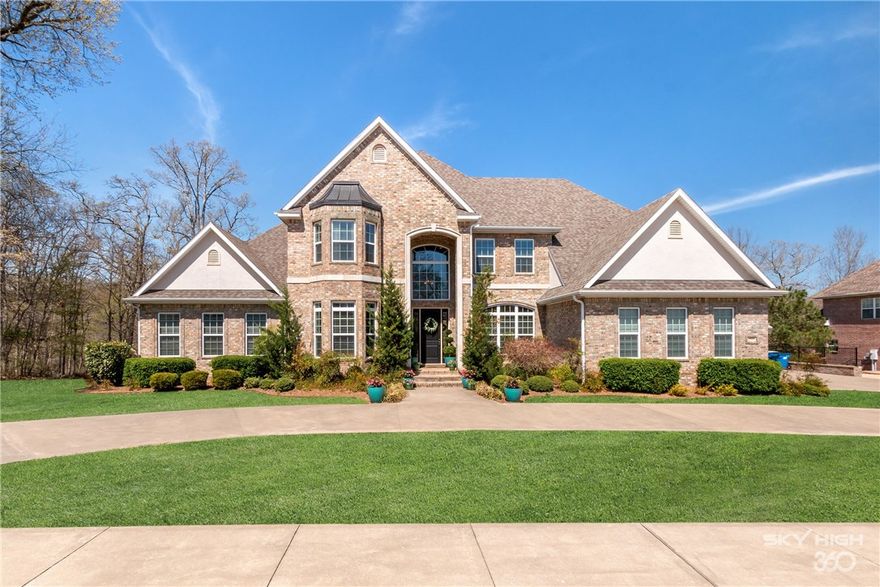 Luxury living with emphasis on family and fun awaits in this updated masterpiece minutes to downtown. Main level features formal sitting & dining. Kitchen opens to command center, walkout balcony and living room. 3 car garage and mudroom. Gorgeous master on main with kids paradise up with large rooms and bonus room. Walkout basement is family dream featuring full kitchen, living room, theatre, workout room, craft & hobby room, saferoom, office and guest room. Beautiful inground pool on private wooded lot.