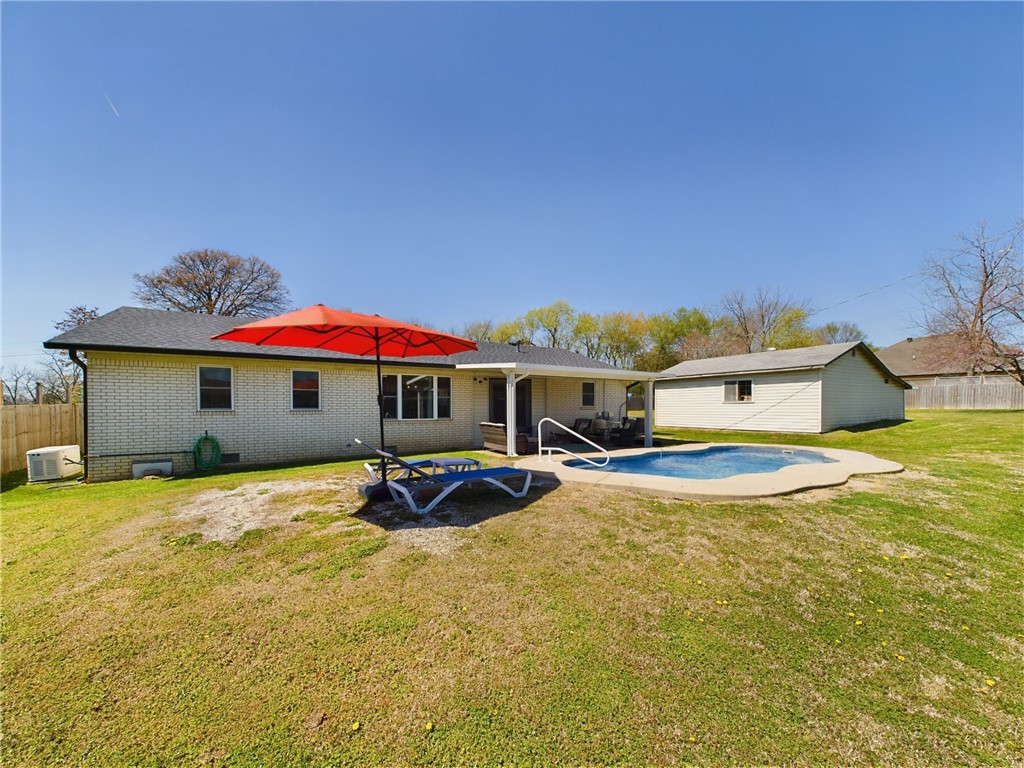 Welcome to your new home in the Rogers' Jack Allumbaugh Subdivision! Check out the Virtual Tour to walk through the property now! This 3-bed, 2-bath gem spans almost 1,500 sq/ft on nearly half an acre. Enjoy modern updates, a new pool, and a privacy fence with an electric gate, and is equipped with a home generator that will convey. This home has a new roof, HVAC in great condition with recent routine maintenance/ductwork cleaning, and water heater, and new appliances that will all convey! Shop building has loads of space for storage or can be used as a shop! Just 5 mins from Downtown Rogers, with the Railyard Bike Park nearby. Walk to the trails nearby, or to Greer Lingle Middle School, and the Northwest Park. Don't miss outāschedule your showing today!