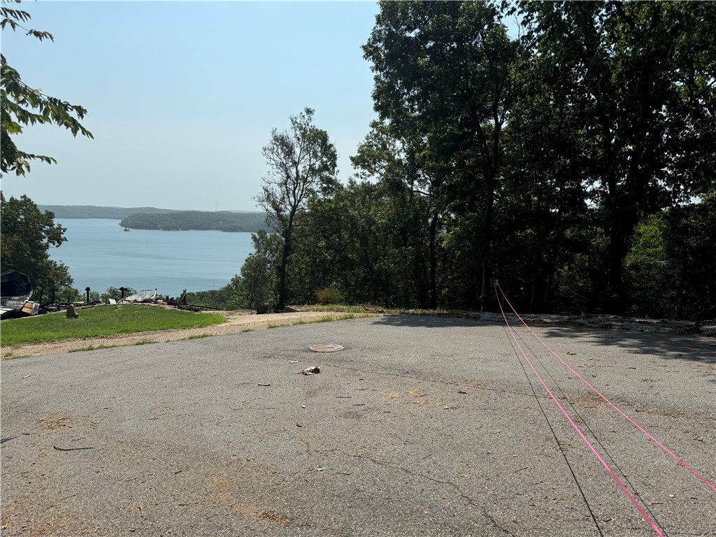 A MILLION DOLLAR BEAVER LAKE VIEW!! Four contiguous lots totaling 1.90 acres of beautiful lake views of Starkey Island and the North end of Beaver Lake. A perfect location to build your dream lake home. This is a listing that you must see to appreciate...schedule a showing with your client today! The residence recently burned. Please DO NOT Cross Over Pink tape into debris field. Viewing from the street only!