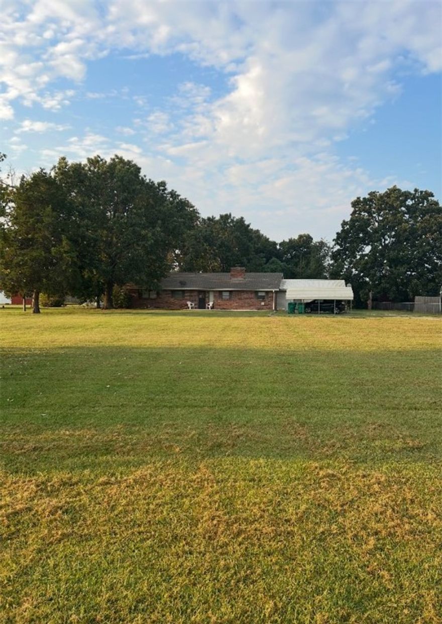 Sitting on 2.02 acres in the heart of town, this 2624 sq ft ranch-style home offers space, convenience, and potential. Located just minutes from Bentonville High School, the property includes two sheds (one with electric) and a large workshop, with a garage- perfect for storage, hobbies, or projects. The generous lot provides endless possibilities: update the existing home, build your dream residence, or explore development opportunities. Rare chance to own an acreage in town close to schools, and all Bentonville has to offer.