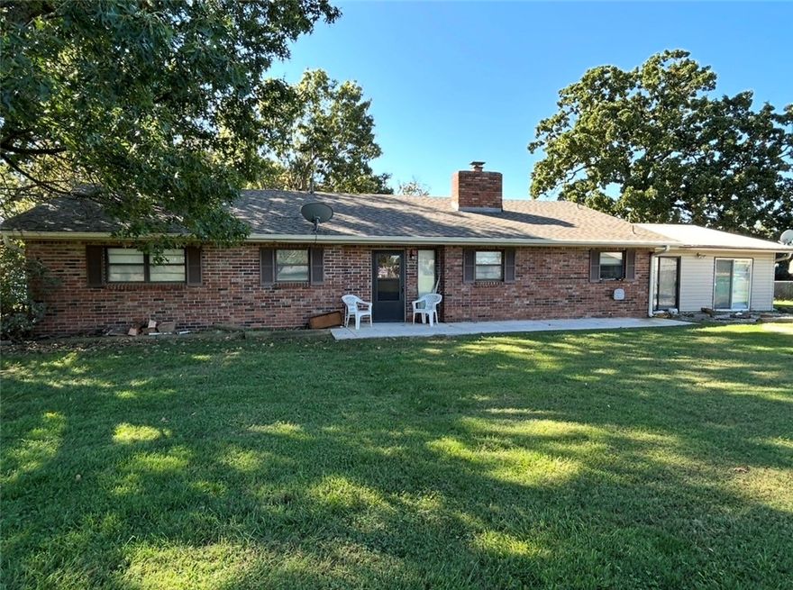 Sitting on 2.02 acres in the heart of town, this 2624 sq ft ranch-style home offers space, convenience, and potential. Located just minutes from Bentonville High School, the property includes two sheds (one with electric) and a large workshop, with a garage- perfect for storage, hobbies, or projects. The generous acreage provides endless possibilities: room to create your own small farm, update the existing home, build your dream residence, or explore development opportunities. Rare chance to own an acreage in town close to schools, and all Bentonville has to offer.