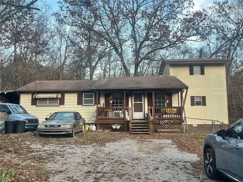 This home is an ideal flip out in the country. 8.4 acres with a wet weather creek and recreational area. Home and shop need a lot of work but hold great potential! No cellphone service but internet available. Being sold as-is.