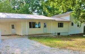 Beautiful private newly remodeled home surrounded by woods and pastureland. All new doors, windows, flooring, cabinetry, paint, HVAC, light fixtures, newly installed wood stove, full basement w/ workshop and much more. Private well, old barn, thornless blackberries, peach, pear, pecan trees, garden area, large shade trees and did I say privacy! See to appreciate.