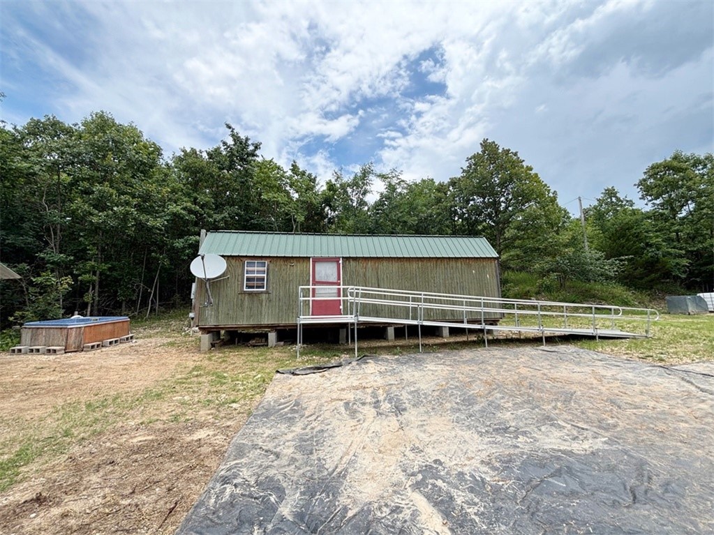 Great opportunity to finish your home or vacation getaway the way you want it. Dwelling is 32x11.4, One open area with room for bedroom, kitchen, living & bath. 2 lofts for storage or beds. Building has electric and is insulated in walls and ceiling. Working drilled well is ready to be plumbed into home. Dwelling needs partitions, plumbing, finishing and septic system. 11x20.4 storage shed has concrete floor. All situated on 4.61 secluded acres in Northern Marion County. Minutes from Hwy 125 Marina and Peel Ferry crossing on Bull Shoals Lake. Approx. 45 minutes to Harrison and White River, and one hour to Branson, MO, and Buffalo River. Great location from which to to explore and enjoy the Ozarks!