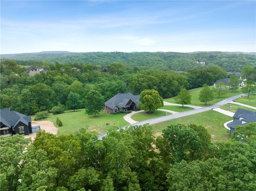 Custom home just listed in Lakeway Estates, an exclusive gated community just minutes from town. This home is situated on a double lot totaling 2.89 acres and offers a seasonal peekaboo lake view. Just a short golf cart ride away sits your own private boat slip with a lift in the community dock. This custom home offers a well thought out open split floorplan with 15 ft ceilings in the living area and all 8 ft doors. Ask your agent for a list of the upgrade amenities and features. Garage is equally impressive offering 3.5 garage space that is ultra long and tall for all your toys! Schedule your showing today and experience why Lakeway Estates is so special.