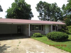 4 Bedroom, 3 bath home with 2 car carport, split floor plan, covered and open deck. This home has a storm cellar, 2 sheds, fenced backyard and is close to school and Wal-Mart.