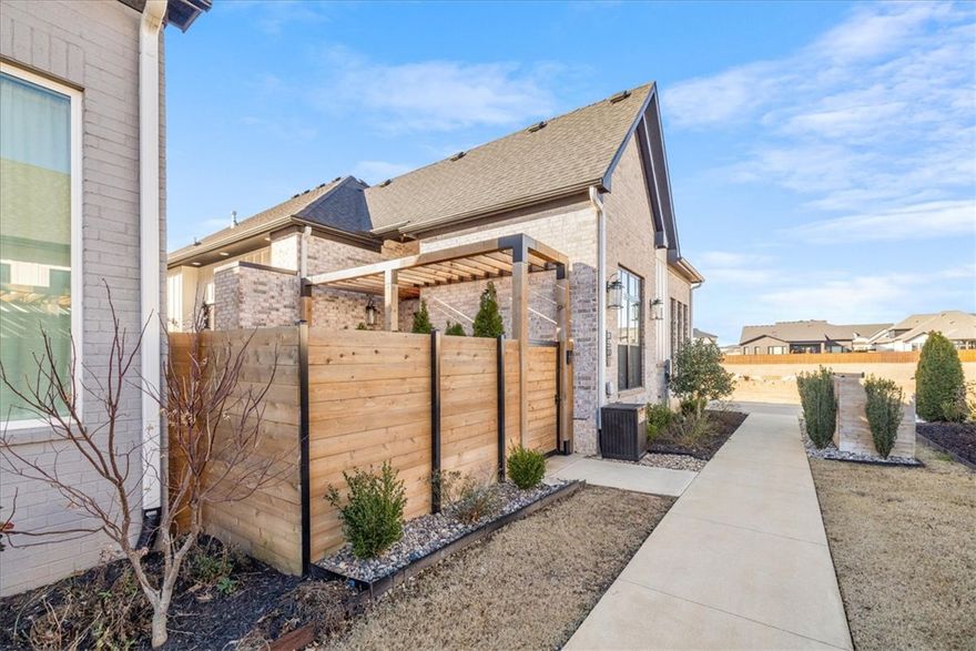 Tucked in the desirable Harmony neighborhood within the Aurora community, this 2,163 sq ft garden home offers 2 bedrooms and 2.5 baths with a well-designed, open layout. Natural light fills the living spaces, highlighting clean lines and thoughtful details throughout. The kitchen features quartz countertops, a striking waterfall island, and abundant storage—perfect for both everyday living and entertaining. The spacious primary suite offers a true retreat, complete with a luxurious, spa-like bath and an oversized walk-in closet. Enjoy low-maintenance living with HOA-covered internet, lawn care, and courtyard maintenance. Community amenities include two pools, clubhouse, playground, dog park, bike repair station, fitness course, and basketball/pickleball court. Convenient Bentonville location with easy access to I-49, shopping, and dining.