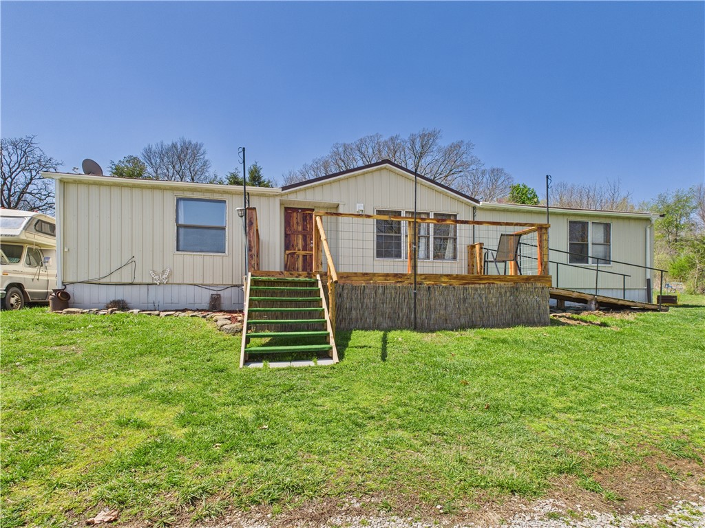 Discover the charm of country living with this 3-bedroom, 2-bath mobile home nestled on 6.81 acres along US Hwy 21 S. This property boasts a 40x60 metal drive-through shop building featuring a sturdy 10" concrete floor, ideal for a truck mechanic's workshop or other ventures. In addition to the primary home, you'll find an extra mobile home and an old homestead, both offering stunning views and currently used for storage. These additional structures present opportunities for extra storage, rental income, or the perfect in-law suite! Enjoy the peaceful rural setting while maintaining easy access to the highway. This property is ready for your pets, poultry, or livestock friends and gardening aspirations.