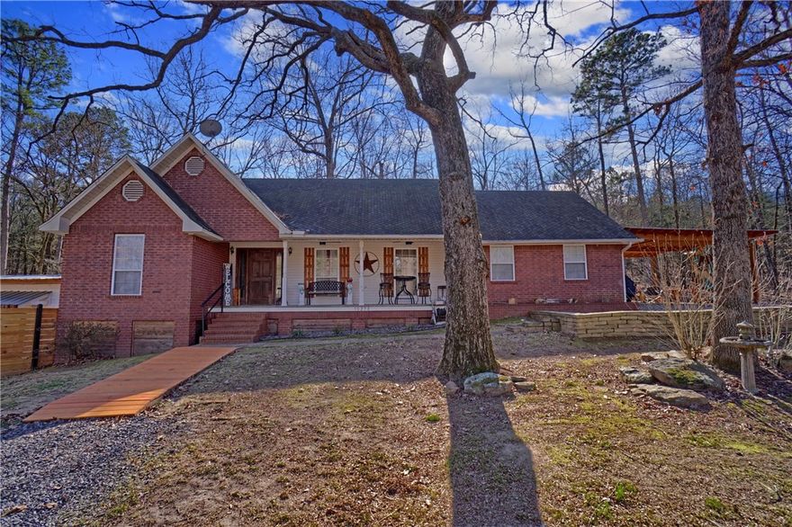 Check out this charming 1,956 sq ft, 3-bedroom, 2-bath with a bonus room. This home is located near Lake Dardanelle, with seasonal lake views offering comfort and convenience in a peaceful and private setting just a short drive from town. The open floor plan creates a welcoming flow between living spaces, Newly remodeled kitchen, bathrooms, and a cozy fireplace ideal for relaxing evenings. Enjoy outdoor living on the back deck or covered front patio perfect for morning coffee, entertaining guests, or relaxing in the hot tub. Additional features include a carport, storage shed, and an attached workshop and storage room located on 1.54 acres. Set up your showing today!!