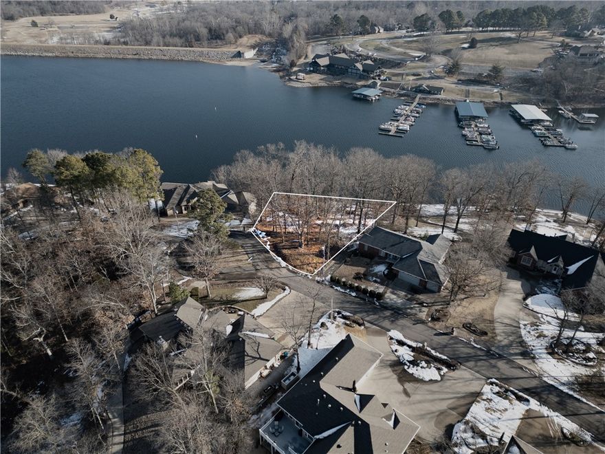 Prime Loch Lomond lakefront lot offering 0.56 acres at the end of a quiet cul-de-sac in the Dornoch Subdivision. Enjoy 141 ft of no-wake shoreline, and peaceful cove views directly across from the marina. Gently sloped, wooded terrain ideal for a walk-out
basement design. Perc test complete; water and cable available at street. A rare chance to secure a build-ready waterfront property with excellent access to boating, fishing, and Bella Vista amenities.