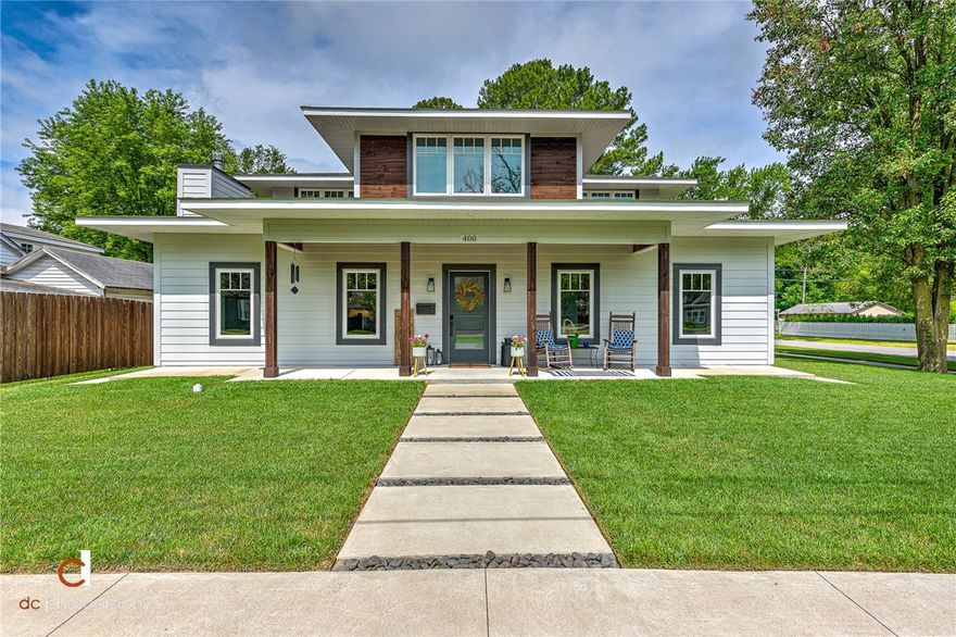 Downtown Bentonville Dream Home. Beautifully designed and detailed, this 2017 custom built home is on the perfect .25 acre, corner lot. Home is 3492 SF (4 bd/3.5ba) + 840 SF (1bd/1ba) income producing apartment over the attached, oversized 3 car garage. Very energy efficient with 12 in. ICF first floor exterior walls, complete foam insulation, Windsor casement windows, Fujitsu mini-split HVAC systems, whole house ERV system, gas tankless water heater, and all LED lighting. Abundance of storage and built-ins, including a built-in bar with wine rack & fridge. Upstairs has a laundry closet, in addition to massive laundry room downstairs. 5 in. wide white oak hardwood floors downstairs, quartz counters throughout, custom cabinets, 36-in. commercial grade Blue Star gas range & hood, 12'x8' Windsor wood clad sliding glass door to patio. Outdoor patio has string lights, built-in fire pit, gas grill hookup, 4 raised wooden garden beds, and an outdoor shower. 1/2 mile walk to everything downtown! This home is a must see!