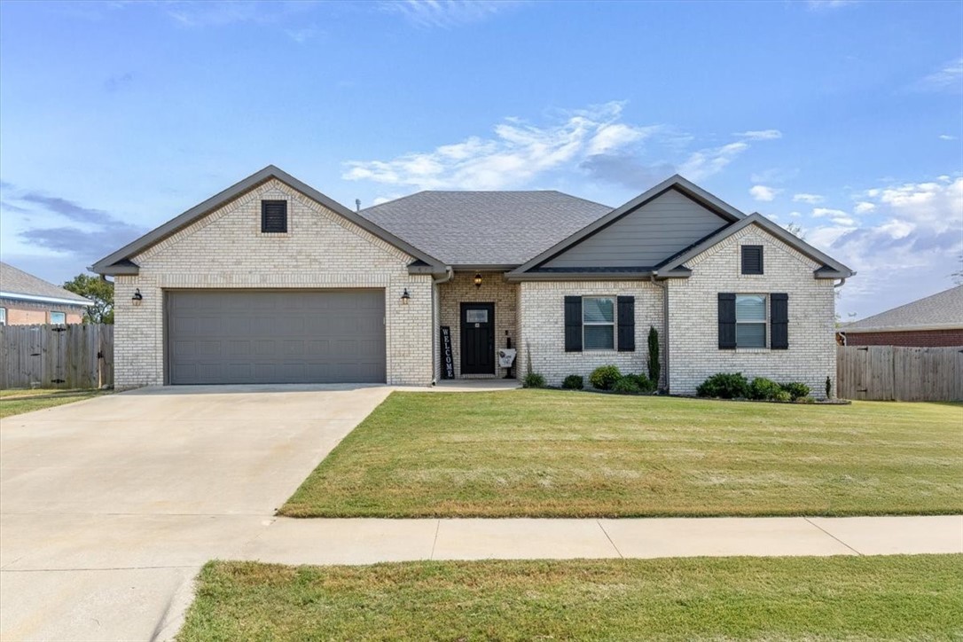 Come see this meticulously cared-for all-brick home that blends both comfort and style! The spacious open-concept living area features rich ceramic wood-look floors, soaring cathedral ceilings with an exposed beam. Cozy up to a warm gas log fireplace that is a wonderful focal point. A large dining area connects to a thoughtfully designed kitchen with all the amenities. The split floor plan includes a private en-suite retreat with dual vanities and a walk-in closet connected to the utility room. Two additional bedrooms are generously sized and share a roomy second bath. Enjoy outdoor living on the covered deck perfect for entertaining or just relaxing.