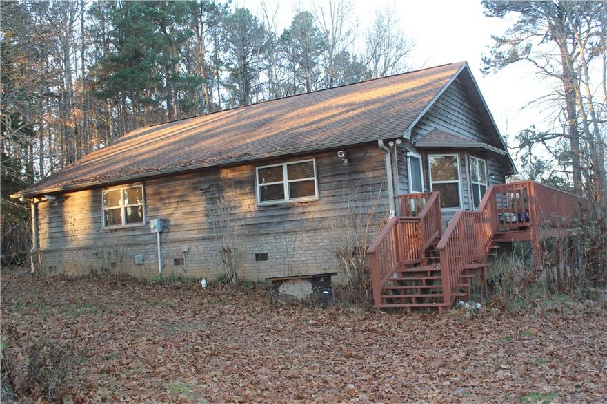 Imagine living just off Scenic highway 21 in Ozone, close to thousands of acres of National Forest, hiking trails, waterfalls, creeks, and lakes. It can be your reality with this gem. The home is nestled on a private 12.54 acres m/l that is fenced in with a cedar sided home,  40 x 40 metal utility building with electric, a pond, duck house, smaller outbuilding and a wet weather creek. The perimeter is surrounded with mature trees with some cleared interior that's usable for all your needs. The home is an open concept with 3 bedrooms. Beneath the wrap around deck you'll appreciate the large crawl space with a well and filtration system. The seller will negotiate leaving a newer zero turn mower, gas cans, gardening tools, wagons, rakes, and furniture in the home. If you desire fresh mountain air and living in a rural nature rich environment, this is a home to see!