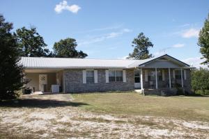 3 bedroom 2 bath brick home near Bull Shoals Lake. 30 acres, spring branch, woods, some open land.