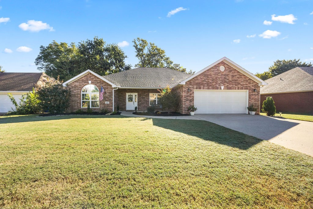 Amazing location, one level, 4 bedrooms, 2,287 sq/ft, all brick, & a private back deck that overlooks greenspace. Plus is located less than a mile from I-49 & only 5 minutes from the HB Hunt Headquarters. What more could you ask for? This 4-bedroom, 2-bath home is spacious & well-appointed, featuring oversized bedrooms, a formal dining area, & a split floor plan. The home has several modern updates, from the beautifully landscaped front & backyard to the updated painted cabinets & hardware. Several rooms have been freshly painted, & you will love the engineered hardwood floors throughout, with no carpet. The living room contains a beautiful gas fireplace & is pre-wired for an entertainment surround sound! The back deck has been recently rebuilt and stained. You will enjoy the private canapé set-up overlooking the greenspace with no neighbors behind you. The backyard has a fire pit to enjoy those cold fall evenings. This house will not last long, so come & fall in love with your new home before it's too late!