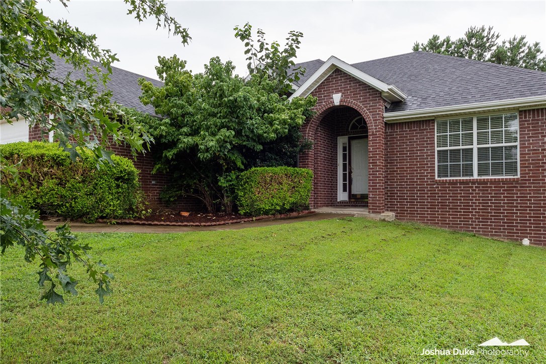 Location, location, location! This beautiful brick home is only 1 mile off of Don Tyson Parkway and less than 2 miles to I-49. It boasts 10 ft. ceilings, crown molding, granite in the kitchen, a cozy fireplace, and a huge deck for entertaining! The heating and air conditioning unit is brand new and will transfer a 1-year parts warranty, along with a 1-year labor warranty to the new owner.