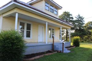 Completely remodeled and ready for its new family. NEW HVAC, roof, hotwater heater, all new bathrooms and kitchen, flooring, lighting, switches and plates, paint and so much more. But the best part may be the cleaned up yard and trees for a view from the covered front porch or view from the back deck. BONUS is a horse barn and several other barns on the property.