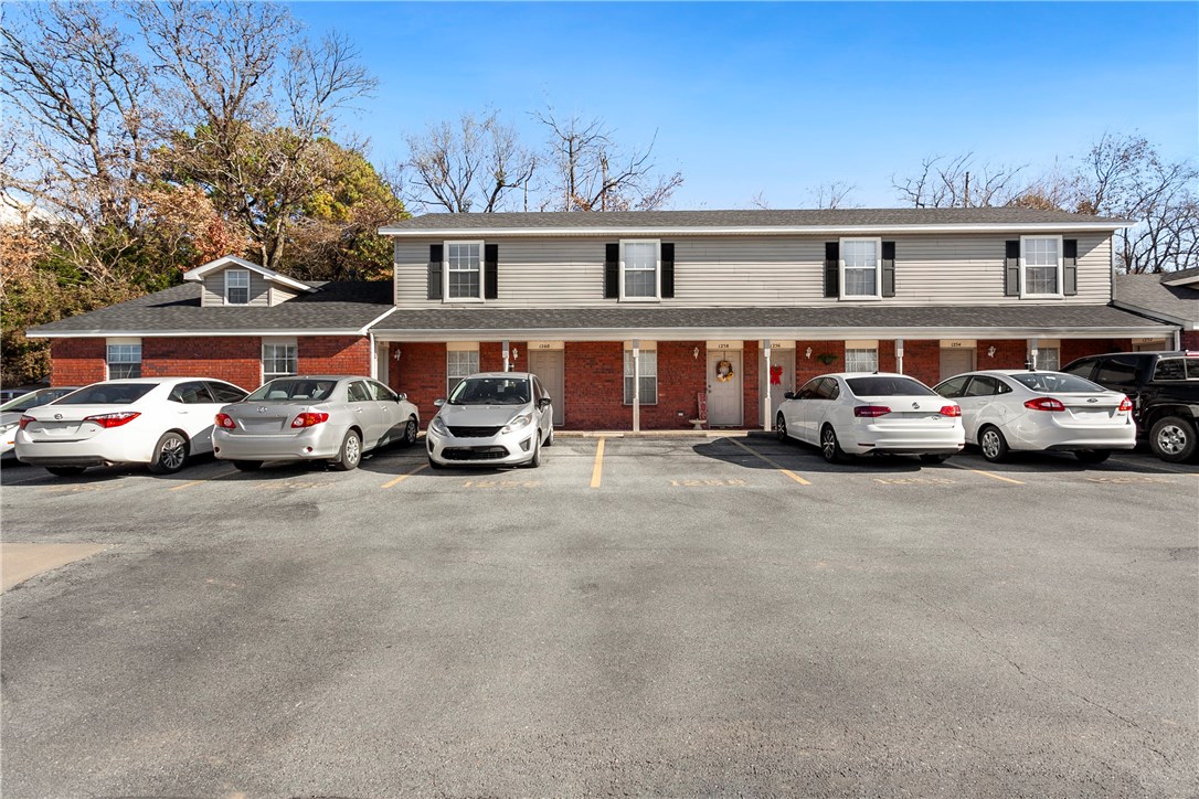 Looking for a property that is low maintenance or maybe your next investment? Check out this great 2BD/1.5BA condo off of North St and just a block away from U of A. 2 story condo features bottom open-floor plan with wood laminate in main living area, gas fireplace, half bath and eat-in kitchen with tile-granite counters and tile flooring. Upstairs features carpeted bedrooms and full bath. Near walking trails, restaurants and more. Don't miss this great property!