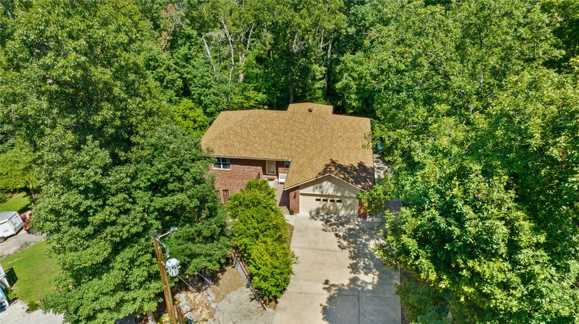 Nestled in the heart of Bella Vista's serene landscapes, this exquisite residence at 22 Kirkbridge Lane offers an idyllic blend of modern comfort and natural beauty. Situated on a generous corner lot, this home boasts impeccable craftsmanship, captivating views, and an array of amenities that cater to the ultimate living experience. Whether you're seeking a year-round haven or a vacation retreat, this property offers an unparalleled opportunity to embrace the Bella Vista lifestyle. With 4 bedrooms, 3 bathrooms and a massive unfinished basement you'll have plenty of room to spread out! Also, the lot next to the house is also available for purchase
