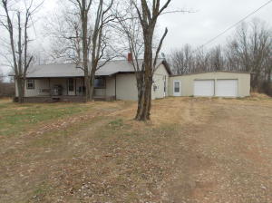 This is a cute farm house on 33.25 acres 0f beautiful views and pastures fenced ,and backyard fenced, workshop barn land lays good highway frontage city water close to Marshal,l priced below appraisal ,Brand new septic system, it also has a 12 x 12 storm cellar, the pasture gets 100 bale of hay each year you could run 10 head of cattle and have horses, pond