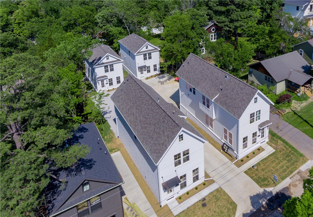 Rare opportunity to own not one, but 2 homes just off the Fayetteville Square!! Property has one 1768 sq ft, 3 bed, 2.5 bath home in front with a detached 1200 square ft. 2 bedroom, 2.5 bath ADU in back. Property is walking distance to The Square, Farmers Market, Dickson St, Walton Arts center, state of the art Public Library, shopping, coffee shops, and several Fayetteville staple restaurants including Hugo's, Feed & Folly, Cheers, Atlas, Tula, Vetro 1925, Taste of Thai, Tiny Tim's Pizza and several more! Easy bike or commute to the University of Arkansas, Razorback Stadium, Bud Walton Arena (The Basketball Palace of Mid-America) & Baum Walker. Both homes feature Hardwood Floors throughout, quartz counter tops, gas range, open layout, low E Windows, cased windows, and so much more! Don't miss out on this rare opportunity to own 2 amazing homes right in the middle of Downtown Fayetteville!