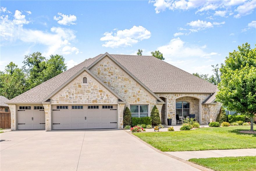 Rare find with a wooded view in the heart of Bentonville next to Coler Creek trail & Elm Tree Elementary/Ardis Ann MS! One level open floor plan 4 beds 3 baths + office/playroom, 2 dishwashers in oversized island w/ Taj Mahal quartzite counters, double oven, underground storm shelter in oversized 3 car 100% insulated garage, central vac, walk in hidden pantry, huge covered back patio, real gas fire pit outback as well as a gas hookup for grill & brick raised garden bed, sprinkler system, wireless security system w/ glass breaker alarms, tons of attic storage, double doors to a playroom/office/ or formal dining right off the living room! Vaulted ceilings with wood beam work, mood lighting thruout, hardwood flooring thruout- NO carpet! Tankless hot water, island in large master closet, gas log fireplace w/ built in bookcases in LR, surround sound in LR, built in office desk & bookcase in master bedroom nook. Irreplaceable location, walk to the Coler trail system down the road and only 5 minutes from downtown Bville.