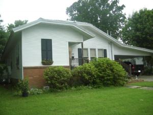 Craftsman style Bungalow, Three bedrooms, 2 baths, lg sunroom, newer kitchen. 2 car attached carport, central gas heat & Electric Air, good storage building, great garden spot. 113729