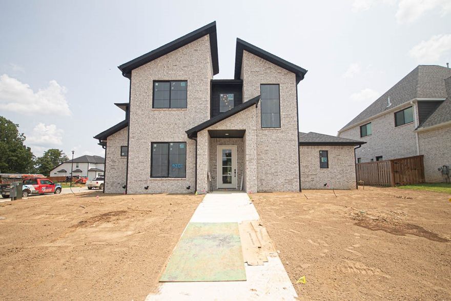 New construction modern home with gorgeous exterior in sought after gated community of Scissortail. Enjoy the stunning living room with custom beams, tiled linear fireplace, engineered wood flooring, tons of light streaming through ample amount of windows and open floorplan. Kitchen features large island, quartz countertops, pot filler, stainless steel appliances, gas cooktop, custom cabinets, double ovens, massive walk in pantry and storage! Home also features a secondary bedroom on the main level. Spacious, private primary bedroom with modern accent wall and luxurious ensuite bathroom. Primary bath with double sinks, storage, walk-in tile shower and stand alone soaking tub. Upstairs features two large bedrooms with walk in closets and a bonus room. Huge covered patio overlooking the large corner lot perfect for entertaining! Scissortail residents have access to TONS of community amenities including gated community, clubhouse, adult pool, family pool, exercise room, playground, firepit and sports court.