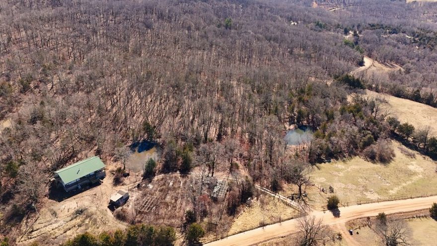 Country home set on 16 plus acres w/ beautiful, open and wooded private views. The main level offers 3 bedrooms, 2 baths, a spacious front porch with sunset views, a large back deck.  Home is built w/  steel trusses, siding, metal roof and very well built!  Upstairs is an additional 1,900sf  attic/bonus flex space awaiting YOUR  transformation as a media room, hobby room, etc. 4 rooms w /one that has a deck overlook and up to 4 BR  potential!  The land is a true homesteader’s dream, established gardens  and orchard w/ 10 varieties of nut and fruit bearing trees . Fruit orchards includes thornless blackberries, elderberries, some wild: Most have been established for 7+ yrs. Large fenced garden area, storage shed/or workshop space, a partial basement w/entry under the front porch provide plenty of room for storage $7,200 flooring allowance is offered for the buyer's choice of new custom flooring in all 3 BR ,to be installed  B/4 closing.  King's River Falls 2 mi. away! Priced under market Priced WELL to SELL Quickly!