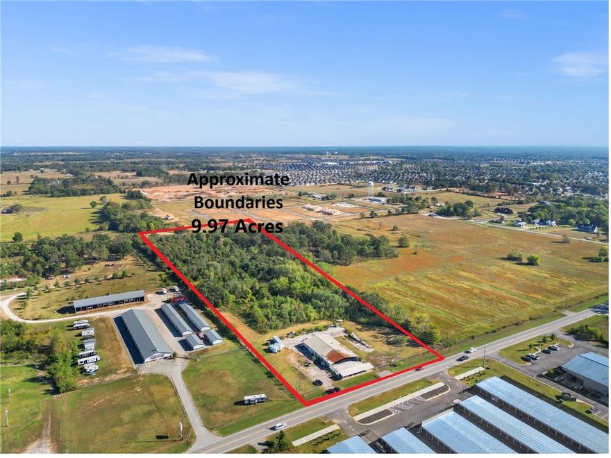 Prime Commerical 9.97-Acre Property with High-Traffic Road Frontage - Vast Business Possibilities! C-2 Zoning! Located on Centerton Blvd with 330ft of road frontage, within 13 Min to Downtown Bentonville and within 18 Min to Hwy I-49 and NWAR National Airport! Level cleared and wooded acreage. Approx. 4,020 usable warehouse space on site, concrete foundation for additional approx 4,200 sqft former office and retail storage space, loading dock, fenced area and plenty of parking. Utilities include private septic, public water and electricity. Property is sold "as is". Call today with any questions and to see the property!