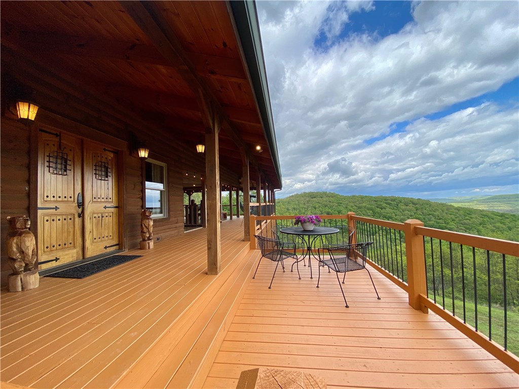 Black Bear Ridge Lodge is a spectacular private estate sitting on nearly 98 acres with custom lodge home that's 4950 sqft + 800 sqft guest house with 2 bed/1 bath + bunkhouse with small kitchen and bath all located in the spectacular Ozark Mountains. Enjoy the panoramic views from 2500 sqft of deck space with outdoor fireplace at the main house. This one of a kind property features a pond + creek, spacious 2 level barn with 3 horse stalls + 600 sq ft workshop, hiking trails, and established wildlife and hunting areas with viewing blind. Stunning main home features custom, high end finishes - JELD-WYN windows and doors, Culligan water softener and reverse osmosis system on drinking water from fridge to ice machine throughout home, local rock fireplace, soapstone countertops, custom-built hickory cabinets and dining room table, 2nd living area downstairs with ensuite, kitchenette, and living area with fireplace. Possibilities are endless - company retreats, wedding venue, or hunting lodge. You won’t want to miss out!