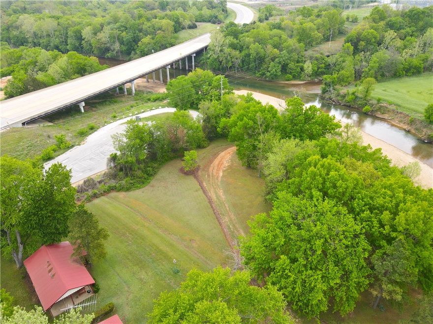 This property has a long history of providing cozy cabins for rent and direct access to the majestic Kings river. Located near the mouth of the Osage River at the Highway 62 bridge east of Eureka Springs, this property offers easy access to the river. Whether you’re an outdoor enthusiast looking to explore the waterways or a business minded individual seeking a new venture, this location could be ideal for both.  Imagine starting your own cabin and canoe rental business or creating your own personal retreat for family and friends. The property’s manicured grounds reflect decades of care and attention. It’s ready for new owners to continue its legacy of hospitality, or make it their own personal residence or getaway property. Those familiar with the Kings river will immediately recognize what a wonderful stretch this is for fishing, and for its proximity to put-in and take-out points for floats. The potential is off the charts for improvement into an absolute storybook setting in an already unbeatable location.