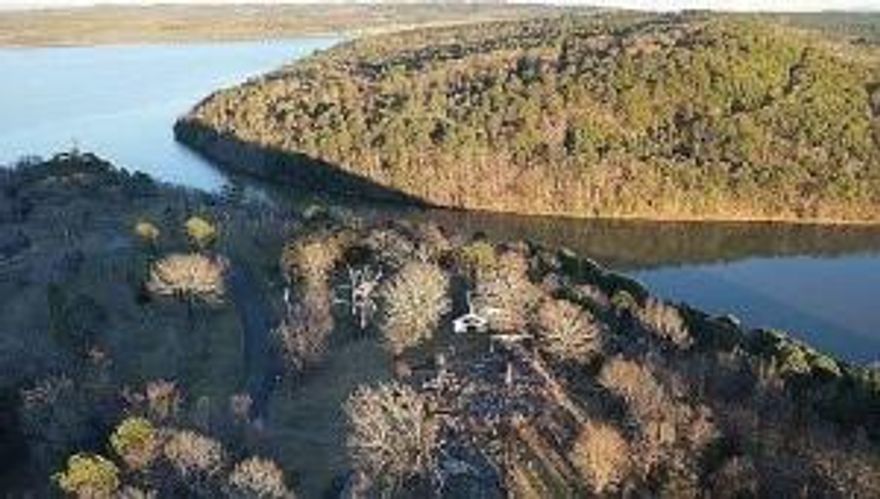 The location of this property is truly one-of-a-kind, offering breathtaking panoramic views of Lake Dardanelle, Dardanelle River, and Mt. Nebo. Coming home to such stunning vistas is a rare privilege in Dardanelle. The small 1-bed01-bath home on the property provides an opportunity for you to finish it according to your preferences and benefit from its potential You have various options for this space. You can transform it into your own cozy tiny home, utilize it as an Airbnb for additional income, or even live in it temporarily while you build your dream home on the property. With electricity already available on the premises, you have a head start in making this space your own This property provides limitless possibilities and allows your imagination to run wild.