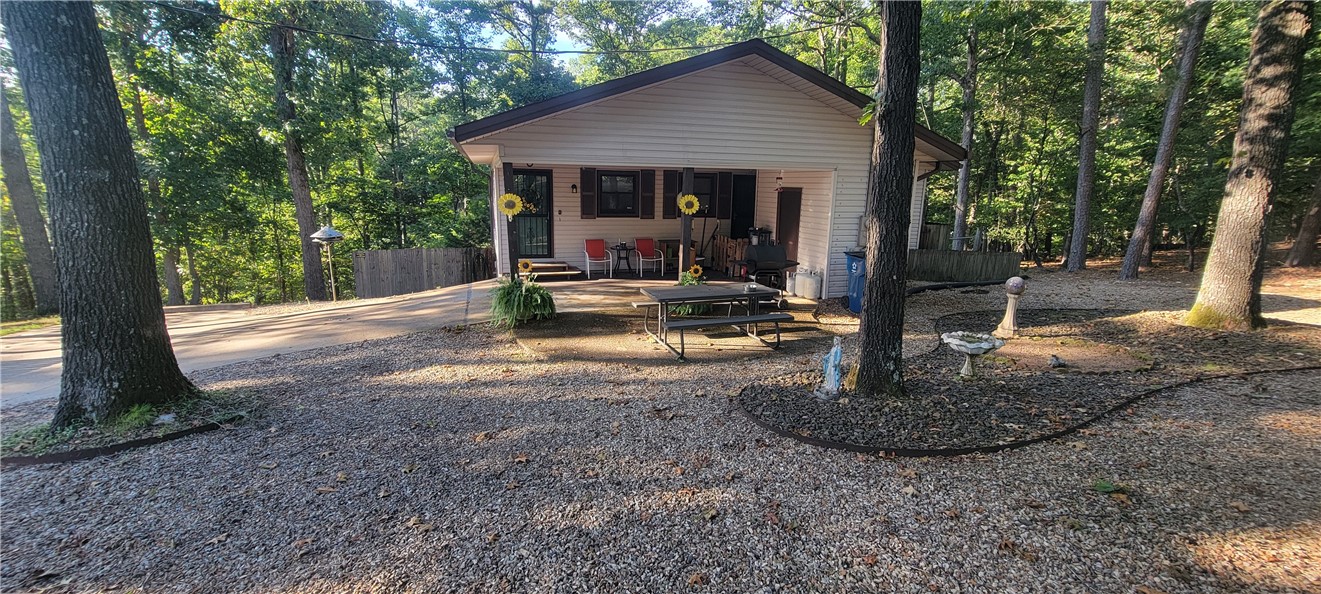 Prime Bella Vista Location
This 2-bedroom, 1.5-bath home is a versatile opportunity—perfect as a starter home, investment property, or a mountain biking retreat. Just ¼ mile from the Back 40 Trails and It’ll Bluff Out access at Hwy 71, adventure is right outside your door.
Built in Approx:1977, the home features solid construction and plenty of potential for customization. Recent upgrades include a renovated bathroom with a low walk-in shower. A propane fireplace adds warmth and character to the living space.
Outdoor enthusiasts will appreciate the storage room with workbench attached to the carport, ideal for bike maintenance or hobbies, and an additional workbench in the crawl space (man door entrance). The carport and extended driveway provide ample parking.
Located in the heart of Bella Vista, this home offers quick access to Lake Ann, Lake Rayburn, multiple golf courses, and Hwy 49 (just 4.5 miles away). Whether you’re looking to invest, settle in, or create a weekend getaway, this is a fantastic find.