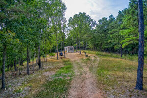 Location, location, location! This 2.96 acres with a newer 2020 mobile home in the highly sought-after area of Hasty Cut Off Road is located just a few miles out of Jasper and less than a mile from the Buffalo National Park. It offers a park like setting with large trees, mountain views and underground utilities. It would be perfect for an RV park, overflow tent camping or rental cabins. Property offers some dirt pads already in place with rural water for camping. Easy access right off of the pavement and only 1.8 miles from the Hasty Access on the Buffalo National River.
