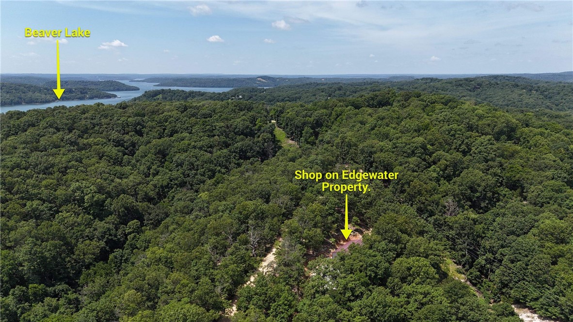 Discover 27.61 Acres of Natural Beauty and Versatility
Nestled in a serene and private setting, this breathtaking 27.61-acre property offers a unique blend of natural features and functional space. Meandering wet-weather creeks weave through the landscape, adding peaceful sounds and seasonal charm, while unique rock formations bring character and visual interest to the land.
At the heart of the property stands a spacious 30x60 shop, perfect for storage, hobbies, or a workshop. Attached is a convenient lean-to, providing additional covered space for equipment or outdoor gatherings. Only 3 miles from Starkey Marina and 15 minutes to Downtown Eureka Springs.
Whether you're dreaming of a secluded homestead, a recreational getaway, or a place to build your forever home.