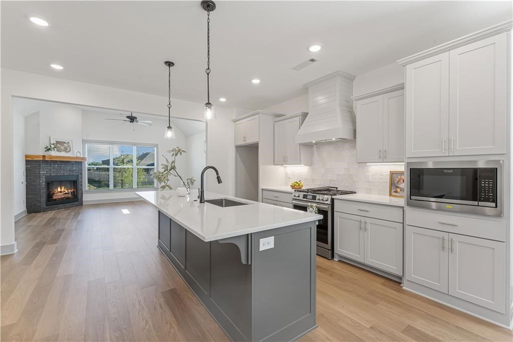 Prime Location in NWA. Welcome to this amazing executive home in Woodlands Crossing neighborhood. This 4 bed, 3 bath homes provides excellent features upgraded 3 cm quartz counters, epoxy garage floor, a designer-brick fire place, and so on! This home provides comfort in addition to convenience with highlights of a dresser in the primary closet, custom cabinets with soft close hinges, stainless steel appliances, and more! Blinds, full wood fence, sprinkler system & professionally landscaped yards. Zoned for Willowbrook elementary, Brightfield Middle School, Fulbright Junior High and BHS, per Bentonville Schools website, Community Center, XNA airport, hospitals, corporate offices, retail, and restaurants. Background check, credit check, and renters insurance are required.