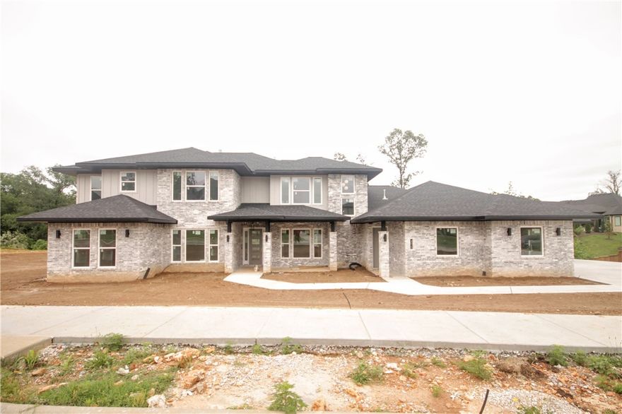 New construction masterpiece.Estate modern style home in the highly sought after gated community of Scissortail.4 car garage,large bedrms w/ their own walk-in closets & baths,bonus room w/ wet bar on the main level made for entertaining w/ access to the deck & loft/bonus upstairs.Large open floorplan with TONS of natural light and space to entertain!STUNNING contemporary kitchen with modern wood accents & designer selected features and finishes.Two dishwashers,upgraded GE Cafe appliances,double ovens, fridge,wine cooler,walk-in pantry & more.Soaring two story ceiling in the living w/ tiled fireplace,tons of windows & access to the back patio.Luxurious master bedrm w/ spa like master bath.Double vanities,soaking tub,large walk-in tile shower & massive walk-in master closet with built-ins & access to laundry rm.Study w/ french doors,formal dining & mother-in-law suite on main level.Large sliding glass doors leading to the covered patio area overlooking the massive fully sodded lot w/ built in grill/outdoor kitchen