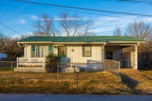 This recently updated 2 bedroom 1 bath home is cute as can be! The home features a metal roof, new hot water heater, attached carport with a serving bar, level chain link fenced yard with a fire pit and a storage shed. Conveniently located. Don't let this one get away!