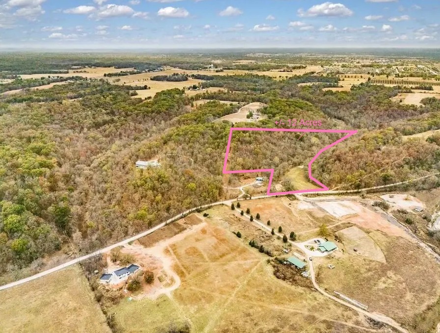 Set amid the rolling hills of North Bentonville, this picturesque ±12 acre property blends serene woodlands with open, gently cleared pastureāideal for equestrian use or private estate living. There is power and well water onsite. Multiple potential build sites provide flexibility to create your dream home, surrounded by nature and privacy. A paddock with shelter is already in place for horses, and a natural stream winds through the land, enhancing the tranquil atmosphere. Home to native wildlife and mature hardwoods, this acreage offers both a peaceful sanctuary and a rare opportunityājust 15 minutes from downtown Bentonville and a private airport.