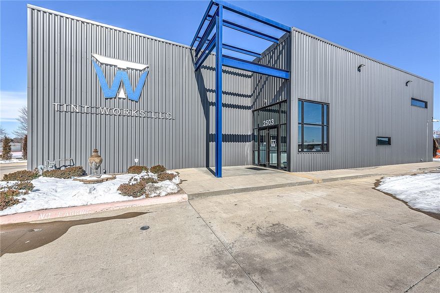 Door height 14' in the back and 9' in front. 25 ton air conditioner. Great space with retail for your customers, garage/warehouse for your business and office and kitchen space upstairs for employees.
