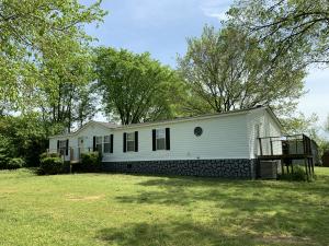 Spacious manufactured home on the edge of Coal Hill located on an elevated shaded lot. 3 sun decks add valuable outdoor living space.Outbuilding. Well maintained w/ new roof (2016), heat, thermopane windows and some flooring. Large living area w/ vaulted ceilings and familyroom w/ FP. Spacious fully equipped kitchen includes an island and breakfast bar.
