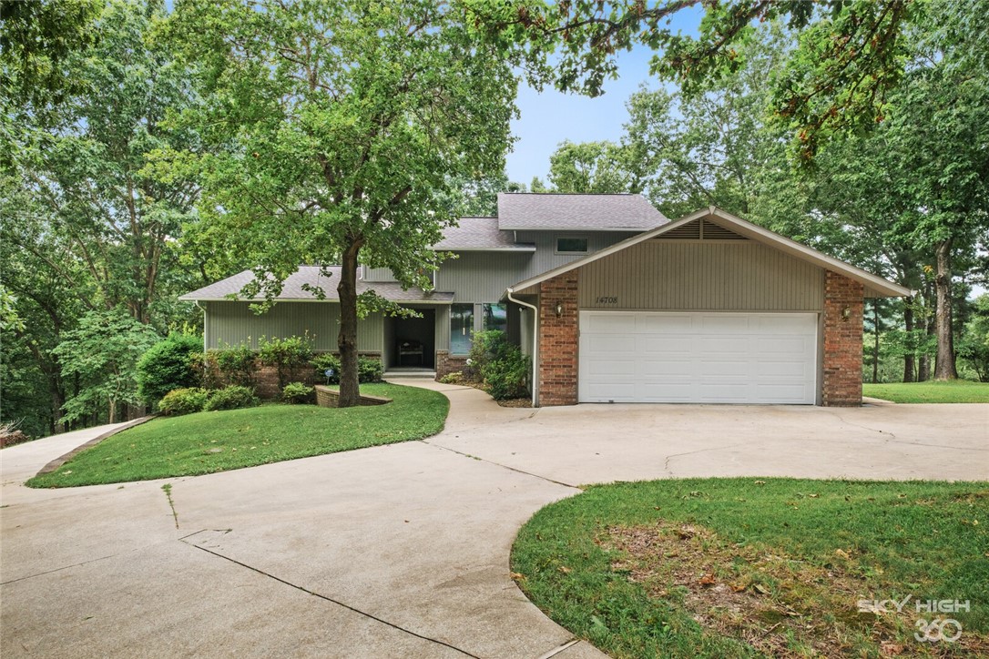 This spacious lake front home was built for entertaining! Beautiful hardwood floors and wood accents enhance the peaceful views of this shaded lot. The home is filled with custom cabinetry and tons of storage, 2 wood burning fireplaces as well as a large granite island in the kitchen, spacious countertops, wine fridge, hidden bar, a dedicated study and amazing master suite. The walkout basement apartment has a separate entrance, fully functional kitchen and laundry, complete with custom media room. Exterior complete with RV pad and whole house gas generator, 2 single storage bays, along with 1 slip/lift in a 2 stall dock.