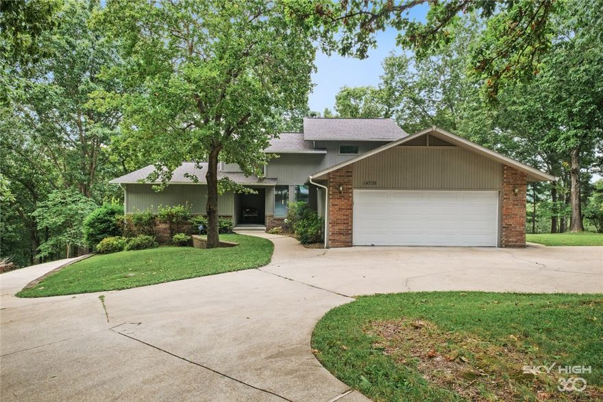 This spacious lake front home was built for entertaining!  Beautiful hardwood floors and wood accents enhance the peaceful views of this shaded lot.  The home is filled with custom cabinetry and tons of storage, 2 wood burning fireplaces as well as a large granite island in the kitchen, spacious countertops, wine fridge, hidden bar, a dedicated study and amazing master suite. The walkout basement apartment has a separate entrance, fully functional kitchen and laundry, complete with custom media room. Exterior complete with RV pad and whole house gas generator, 2 single storage bays, along with 1 slip/lift in a 2 stall dock.