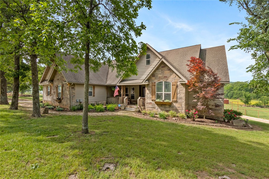 Country meets convenience. Just 8 miles from the University of Arkansas Campus you will find this rustic beauty. The beautiful home features 4 beds/3baths, an upstairs bonus room, wood burning fireplace, wonderful views off the back of the home, and a screened in porch overlooking your 9+ acres of land. Outside features a nice deck, rock patio, above ground pool, a detached 2 car garage with a bathroom, a 36X40 Barn w/ concrete floor, water & electric, 4 - 10 X 10 horse stalls each with a 10 X 16 foot run-under lean to going outside, a 16 X 40 lean to off each side of the barn, a 10 X 12 loafing shed, and a 175 X 275 ft arena pad. The property boasts a nice pond and a overall sense of a private equine oasis, all while being on a paved road & conveniently located close to multiple cities. Seller & co-listing agent are related. Brand new roof added to home in June 2023. Back on the market due to no fault of the Seller/home. New price, don't miss this one.