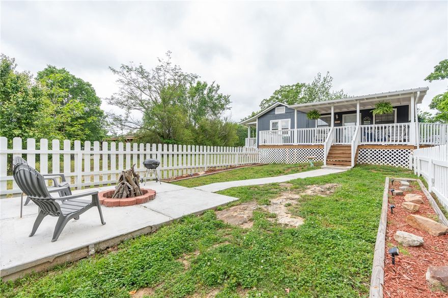 Have you been thinking of owning a home instead of renting? This could be your opportunity to make that move and possibly for the same monthly cost. Located in the desirable Greenwood School District, this home sits at the end of a quiet cul-de-sac, offering privacy and a peaceful setting on nearly a 1/2 acre lot. Recently renovated the home feels open and inviting. The living room features a beautiful focal wall with an electric fireplace and built in TV, creating a cozy space you'll love spending time in. Step outside onto the large partial covered deck for even more living space, ideal for relaxing and hosting friends and family. The fire pit adds the perfect touch for enjoying quiet nights.  With added features like a storage shed and a tranquil setting, this home truly offers comfort, space, and value.  There are too many recent renovations to list so come take a look and buy.