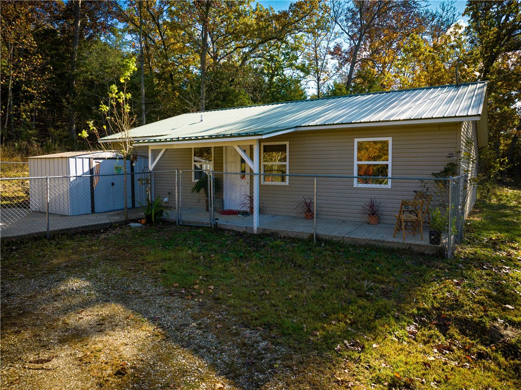Enjoy wildlife at the heart of a GREAT outdoor recreation hub of NWA in this 1 bed, 1.5 bath home on 3 acres partially cleared and wooded, within a .5 mile of Kingston Highschool and Kingston Station. Perfectly located between the rivers. 22 miles to Horseshoe Canyon Ranch a nation-wide known rock climbing campsite, 15 miles to Kings River and 23.5 miles to Buffalo River this property would be great for a short term vacation rental, getaway outdoor cabin & with acerage to spare, setup for another build or a micro farm. Has a large cement slab porch with chain linked fence for animals, dogs or the potential for a covered patio to be built. In Madison County limits leaving you with more freedom for your property.
Top of the line metal roof. HVAC inducer replaced 2022 with new furnace piping. A very low-maintenance home with extended cabinetry for organization. Comes with all appliances, refridgerator, washer & dryer. Has an extra sink in kitchen & mudroom sink in laundry room. Lots of potential!