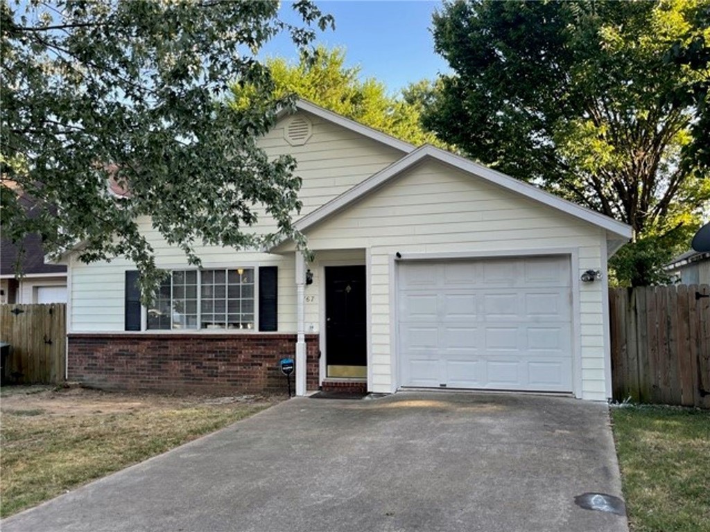 Cute 2 bedroom 2 full bath close to I-49. Fresh paint, eat in dining area, fireplace in living room, hard wood flooring in main living area and bedrooms, kitchen has tile floors. Primary bedroom has large walk-in closet, one car garage privacy fenced in back yard.