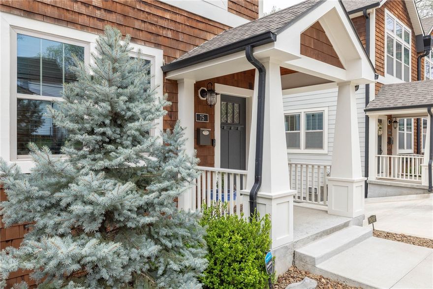 This stunning, like-new townhouse is all about location! Just a few blocks from the vibrant Fayetteville Square, iconic Dickson Street, and right across from the Fayetteville Public Library, you'll have the best of downtown at your doorstep. Designed for effortless living and entertaining, the open-concept layout flows from the sleek kitchen—complete with granite countertops, gas range, under-cabinet lighting, and pantry—into the living and dining areas, extending out to a deck with a built-in grill. The solid wood floors, gas fireplace, and 10' ceilings with oversized fans add sophistication and comfort. The custom bathrooms are beautifully designed, and there's even an additional 450 sq.ft. of finished, heated, and cooled basement space. This is the perfect downtown retreat!